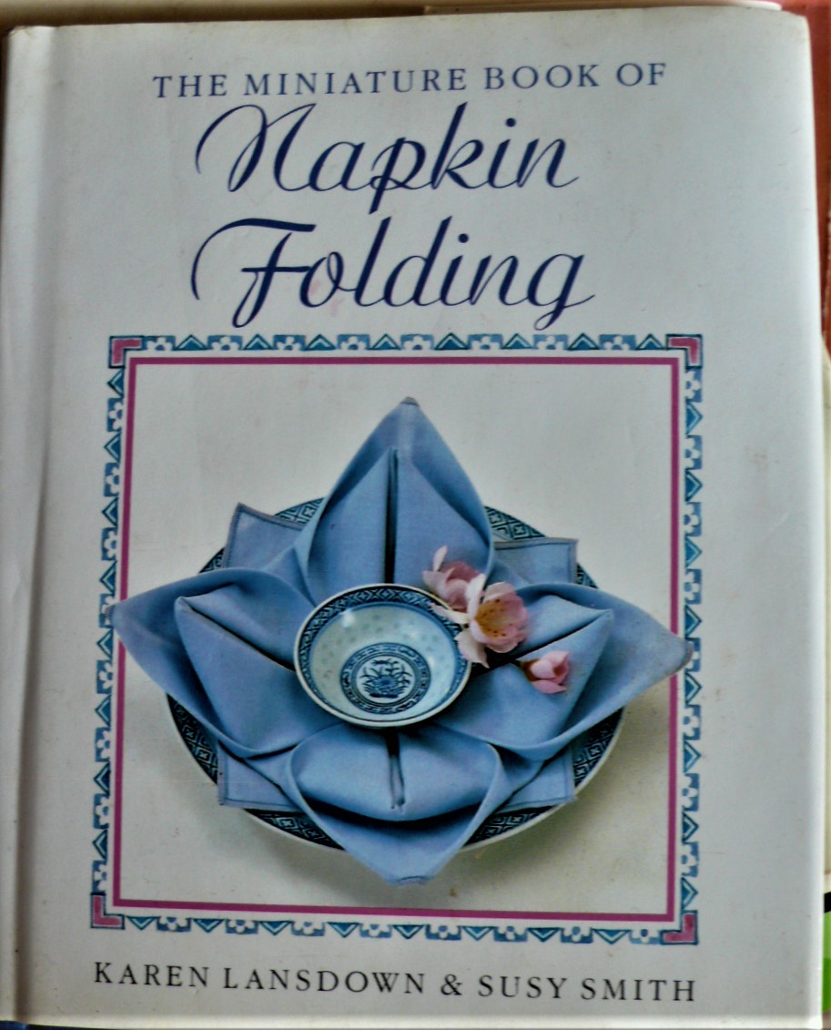 the miniature book of napkin folding